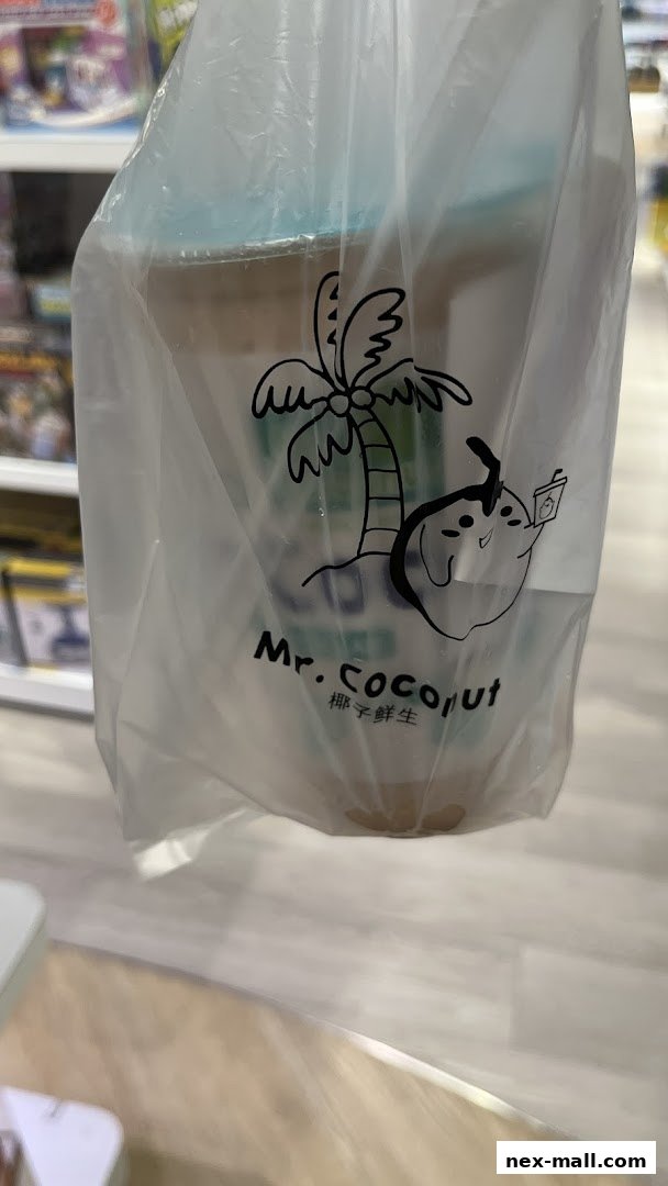 A plastic bag from Mr. Coconut with a coconut character and palm tree logo.