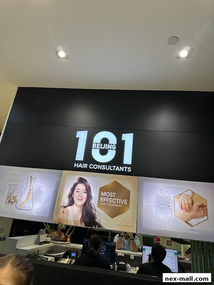 The reception area of Beijing 101 Hair Consultants with staff at computers and promotional displays.