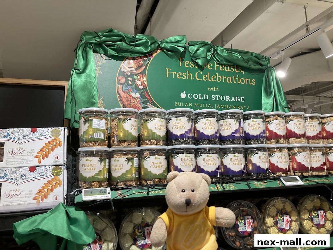 A display of festive candies and dates at Cold Storage, with a teddy bear mascot.