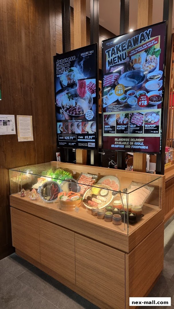 Shabu Sai restaurant display with hotpot ingredients and takeaway menu boards.