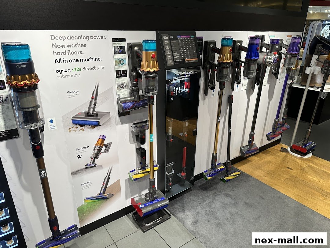 A display of various Dyson vacuum cleaners, highlighting the Dyson v12s detect slim submarine model.