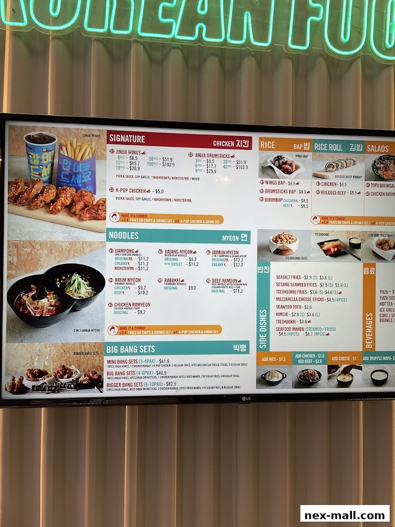 A digital menu board displaying various Korean food items including chicken, noodles, rice dishes, and side dishes.