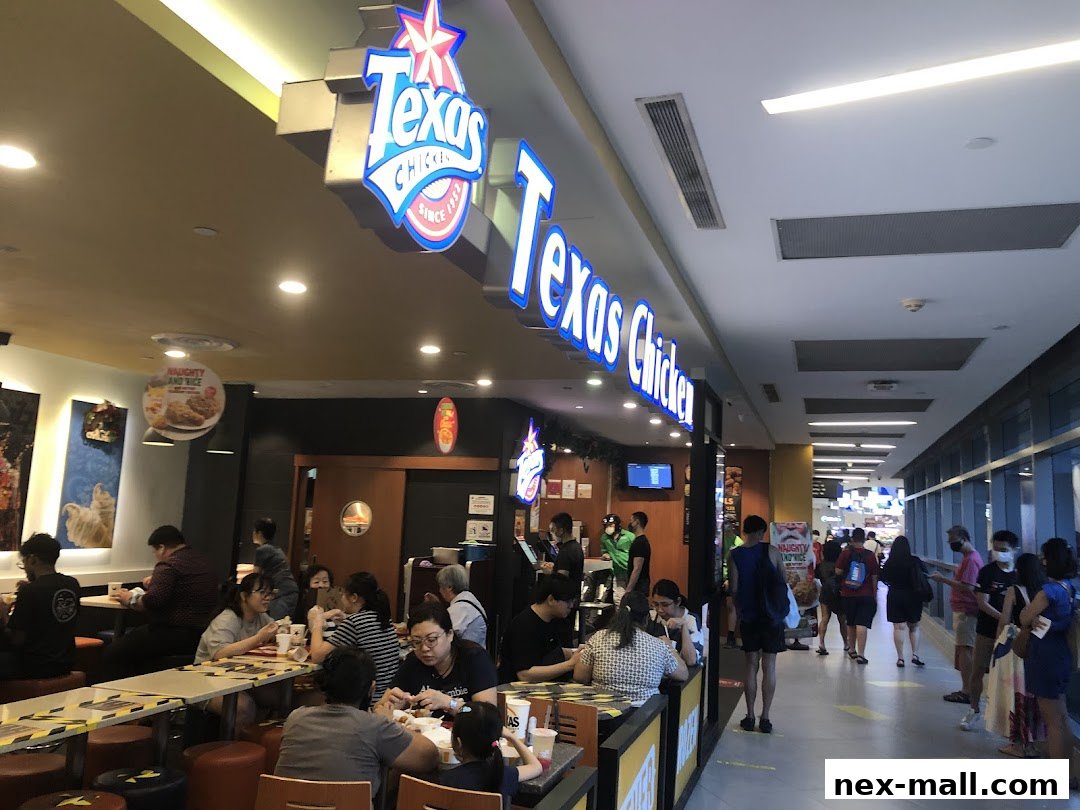 People dining and queuing at Texas Chicken NEX, a fast-food restaurant.