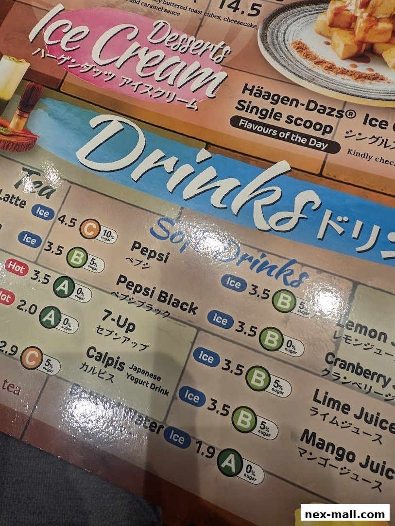 A close-up of a menu featuring ice cream, drinks, and soft drinks with prices and sugar content.