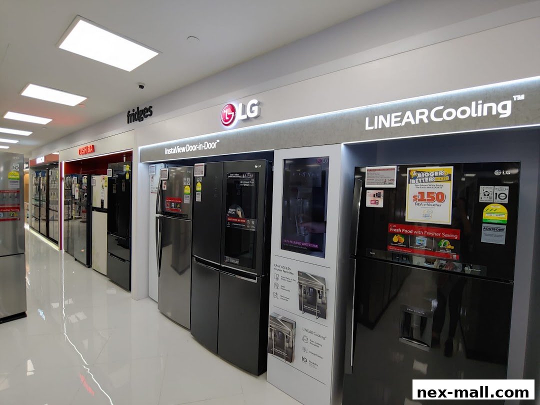 A display of LG and Toshiba refrigerators, featuring various models and promotions.