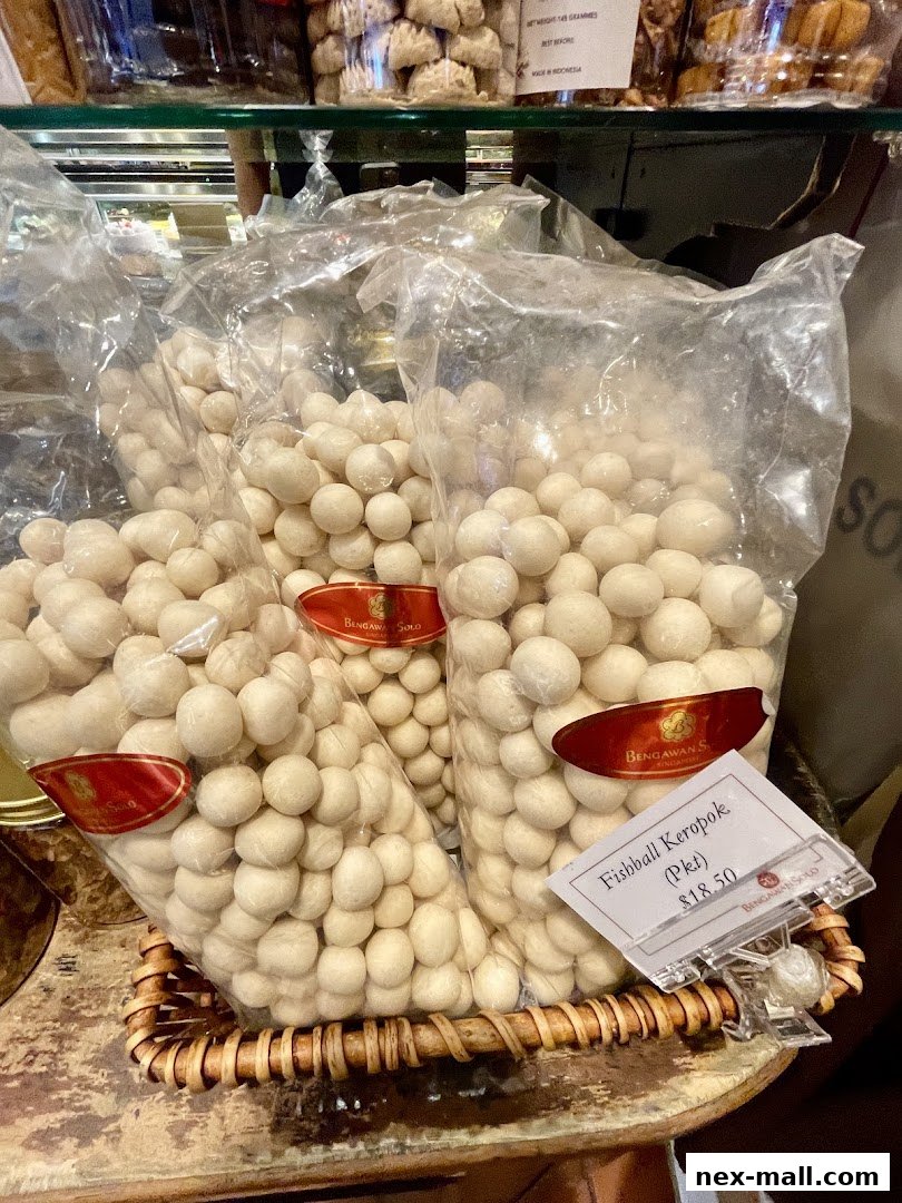 Bags of white fishball keropok snacks displayed in a basket at Bengawan Solo.