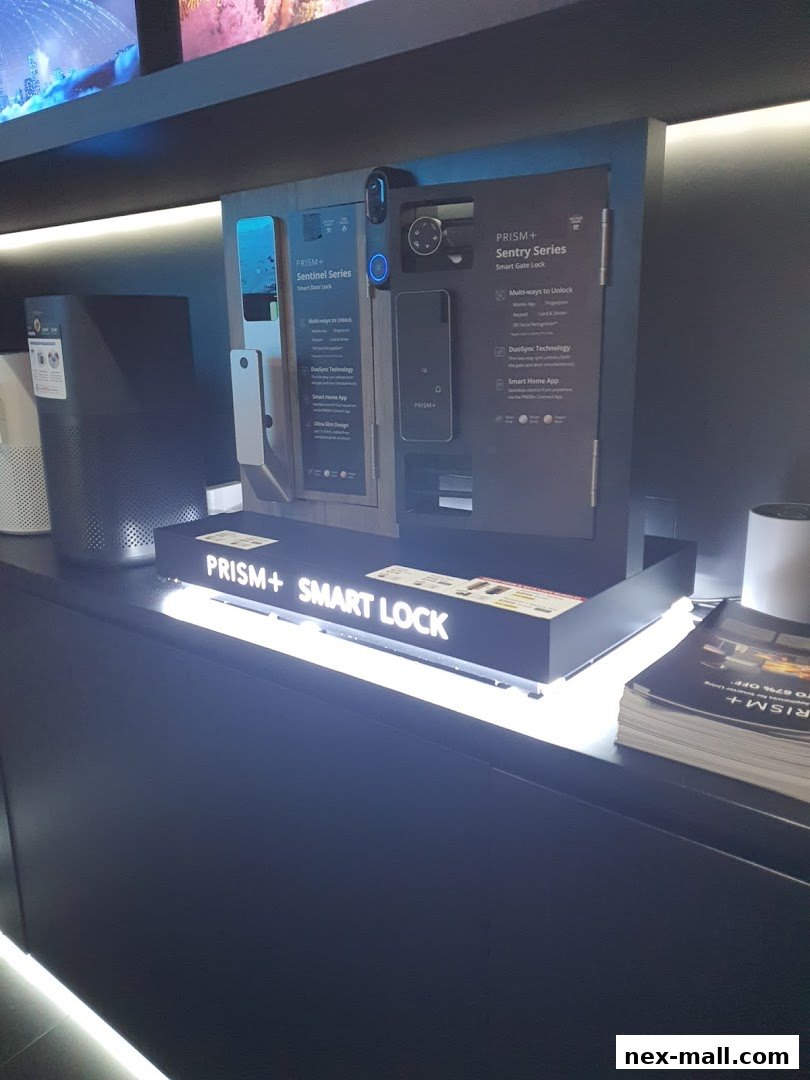 Display of PRISM+ smart locks, including Sentinel and Sentry series, with promotional materials.