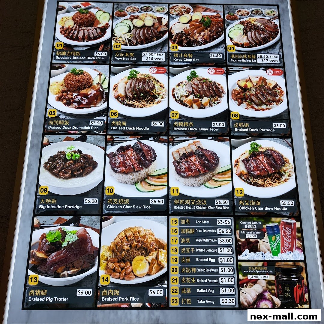 A menu board displaying various braised duck and char siew dishes with prices.
