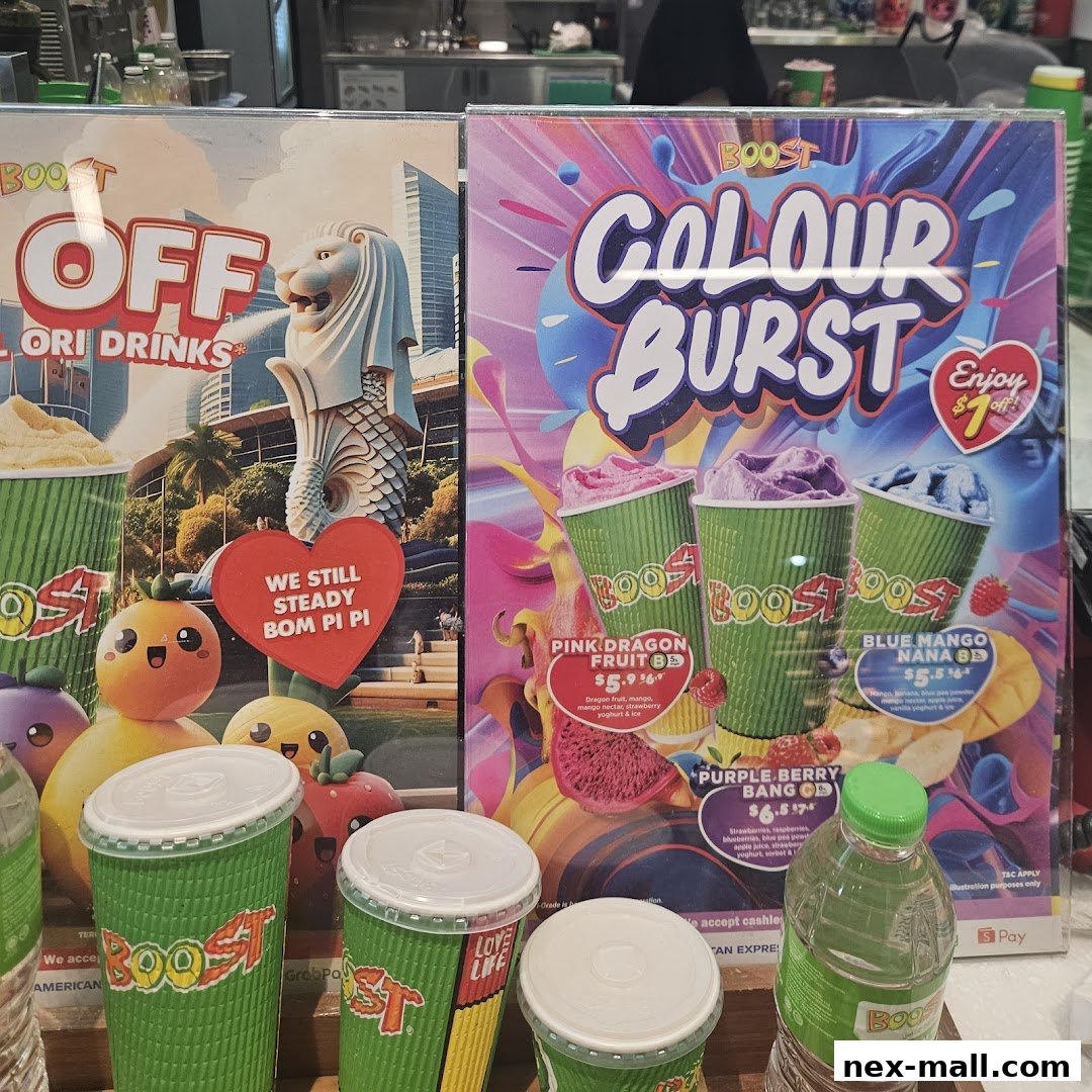 Promotional posters and cups for Boost Juice, showcasing colorful drinks and offers.