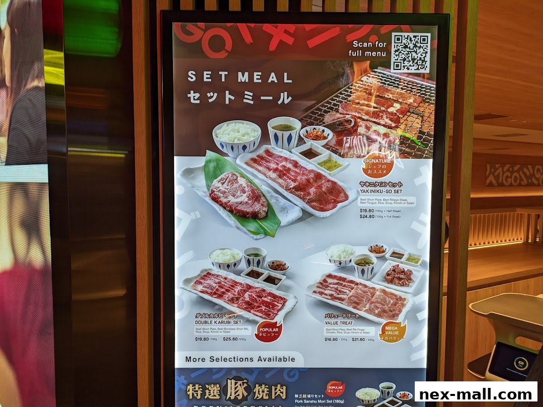 A menu board displaying various Yakiniku set meals with prices and descriptions.