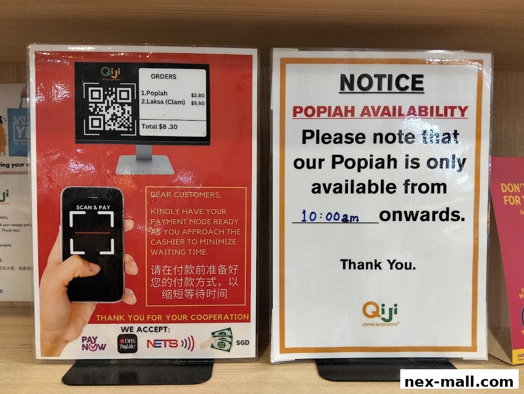 Two signs from Qi Ji, one showing payment instructions and orders, the other a notice about Popiah availability.