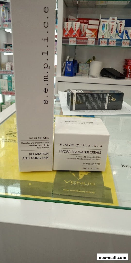 Skincare products displayed on shelves, including a large box and a cream jar.