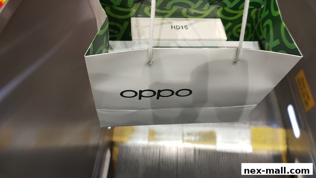An OPPO shopping bag with a product box inside, on an escalator.