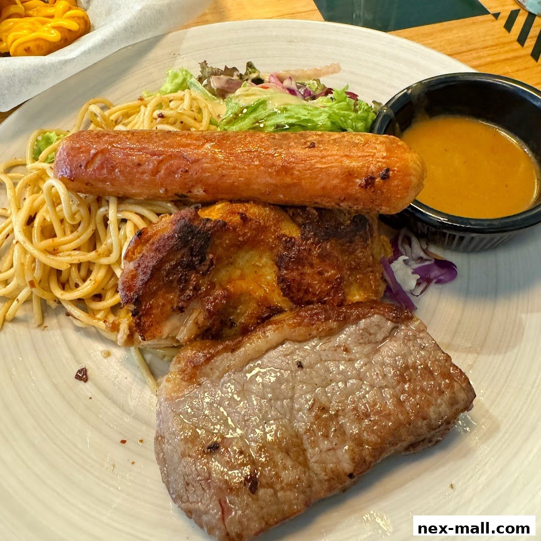 A hearty meal featuring steak, chicken, sausage, spaghetti, salad, and dipping sauce.