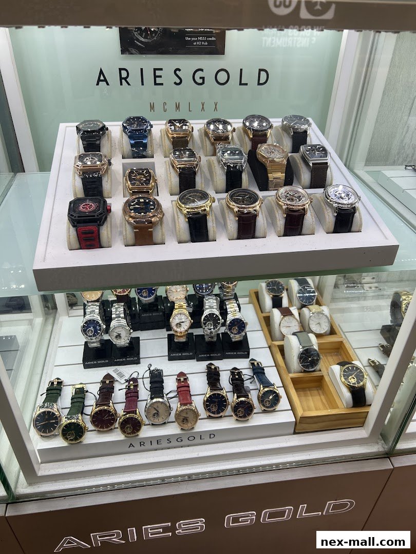 A display case filled with various Aries Gold watches, showcasing different styles and colors.