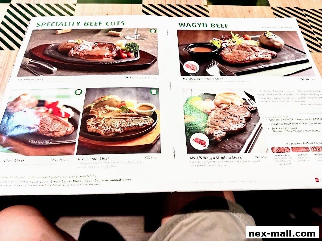 A menu showcasing specialty beef cuts including Ribeye, T-bone, and Wagyu steaks.