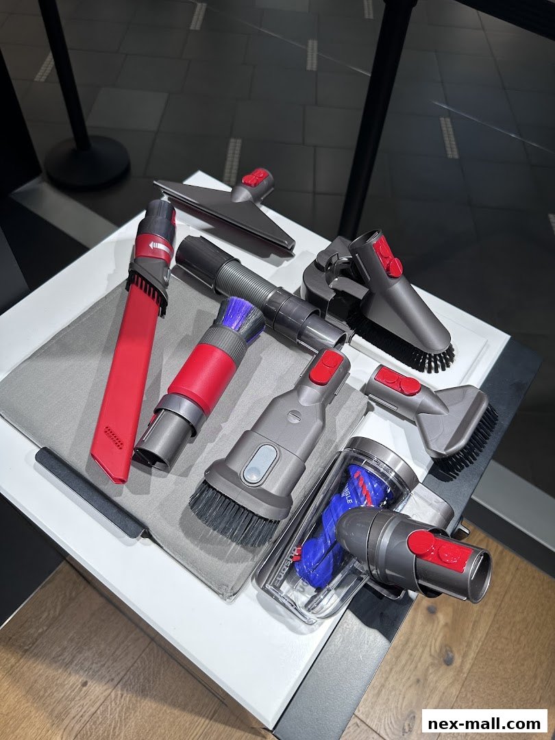 A collection of Dyson vacuum cleaner attachments displayed on a white surface.