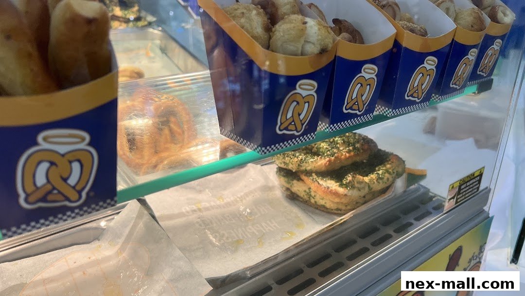 A display case filled with freshly baked pretzels and pretzel bites from Auntie Anne's.