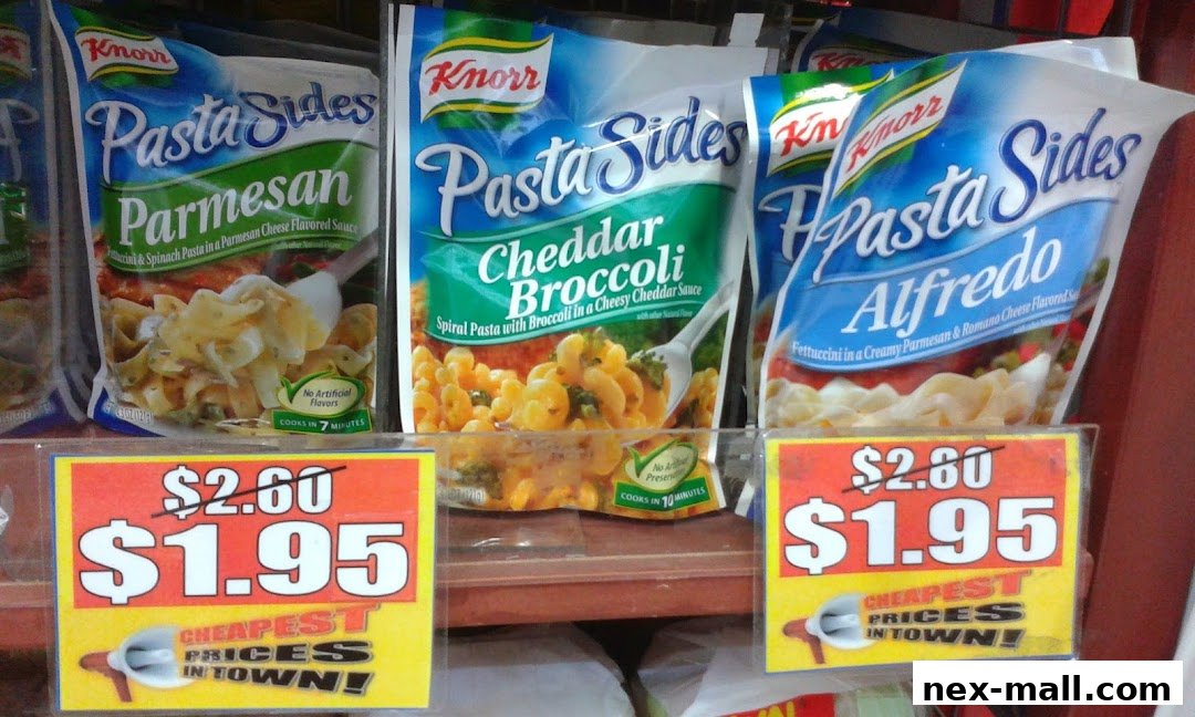 Knorr Pasta Sides in Parmesan, Cheddar Broccoli, and Alfredo flavors on a store shelf with sale signs.