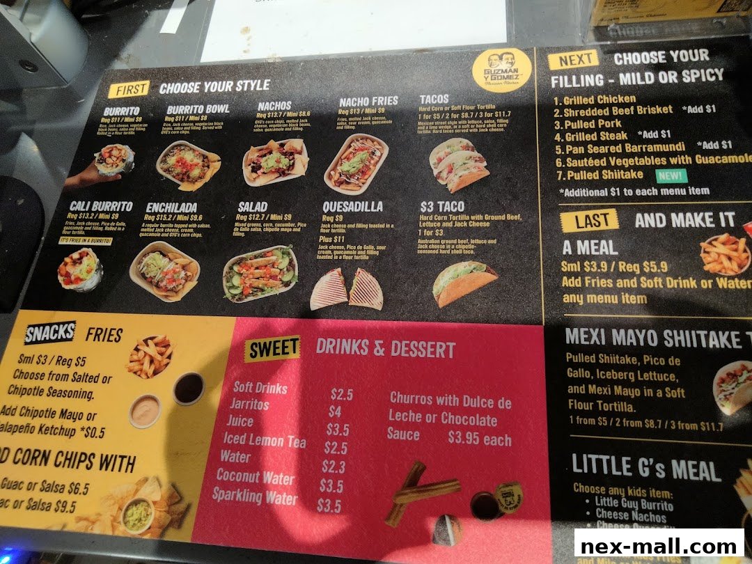 A menu board for Guzman y Gomez featuring various Mexican-inspired dishes and drinks.