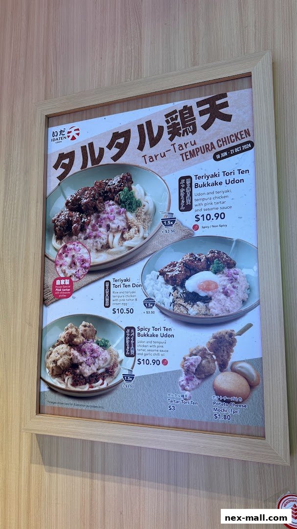 A menu board showcasing various tempura chicken udon and donburi dishes with prices.