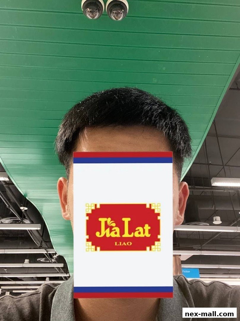 A person's face is partially obscured by a sign with the logo 'Jia Lat LIAO'.