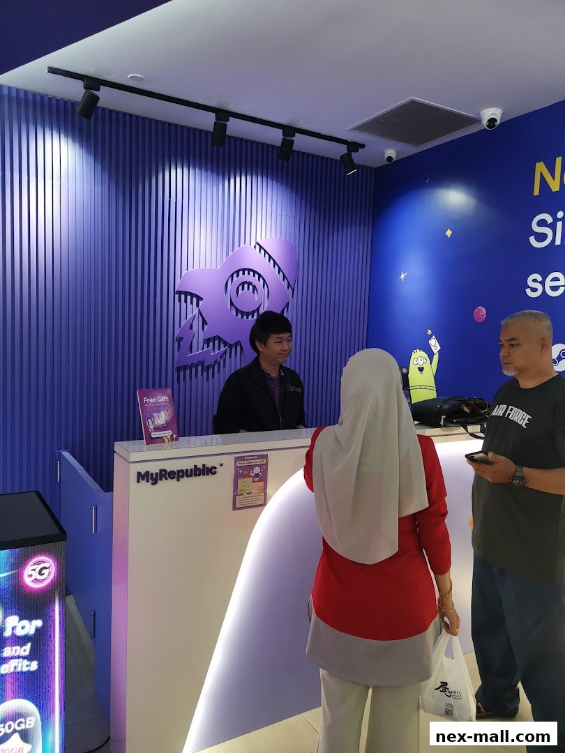 Customers interacting with staff at the MyRepublic store counter.