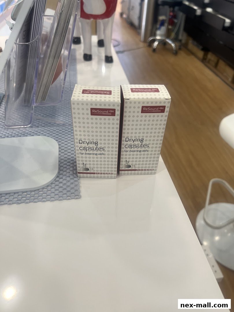 Two boxes of ReSound GN drying capsules for hearing aids are displayed on a white surface.