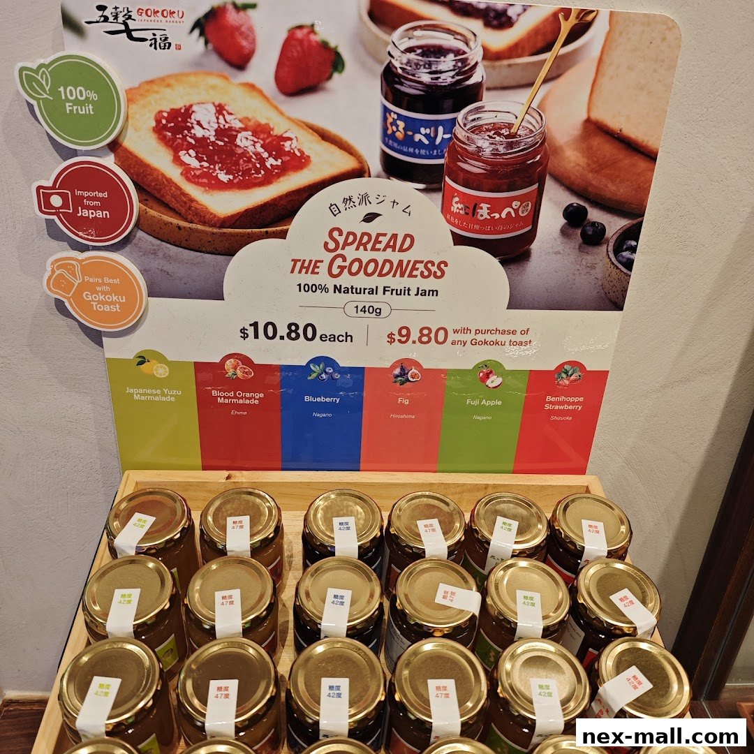 A display of Gokoku Japanese Bakery's natural fruit jams with various flavors and prices.