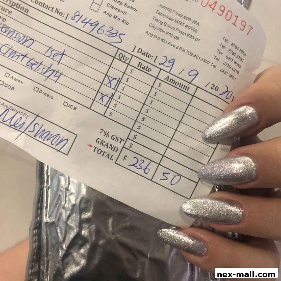 A receipt from Nail Palace with a customer's hand showing off silver glitter nails.