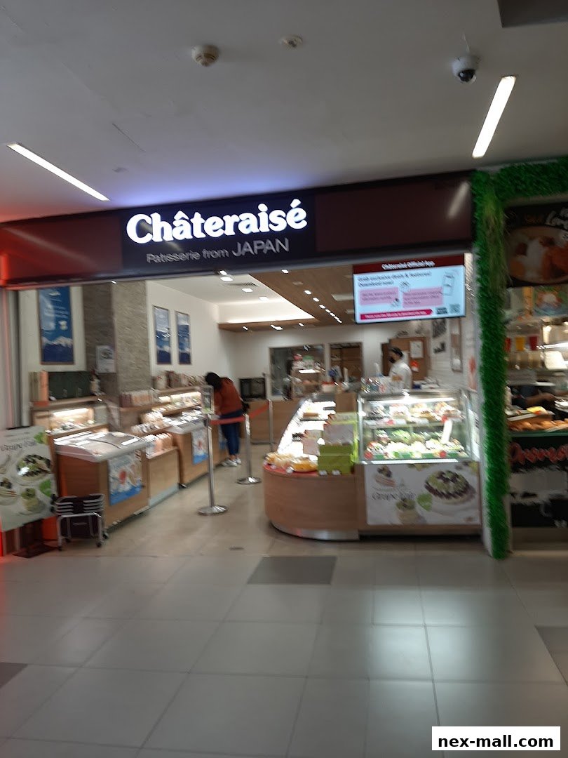 The Châteraisé patisserie shop front, showcasing cakes and pastries in display cases.