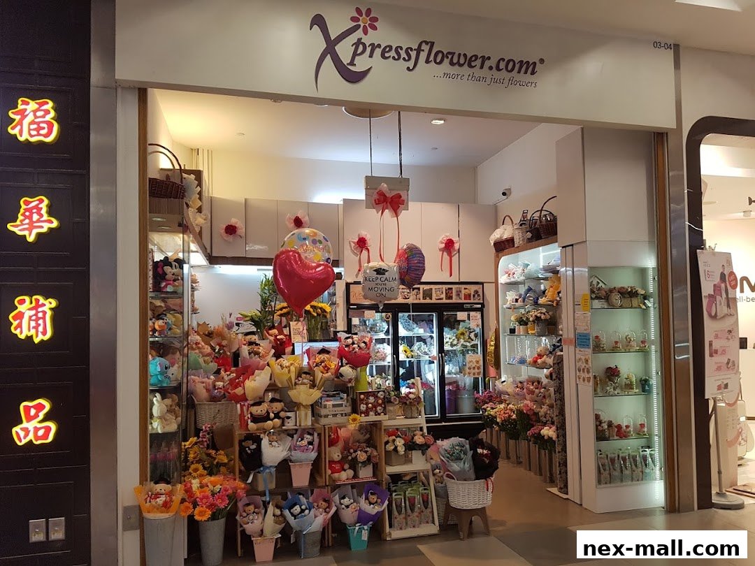 A flower shop called Xpressflower.com, filled with bouquets, stuffed animals, and balloons.