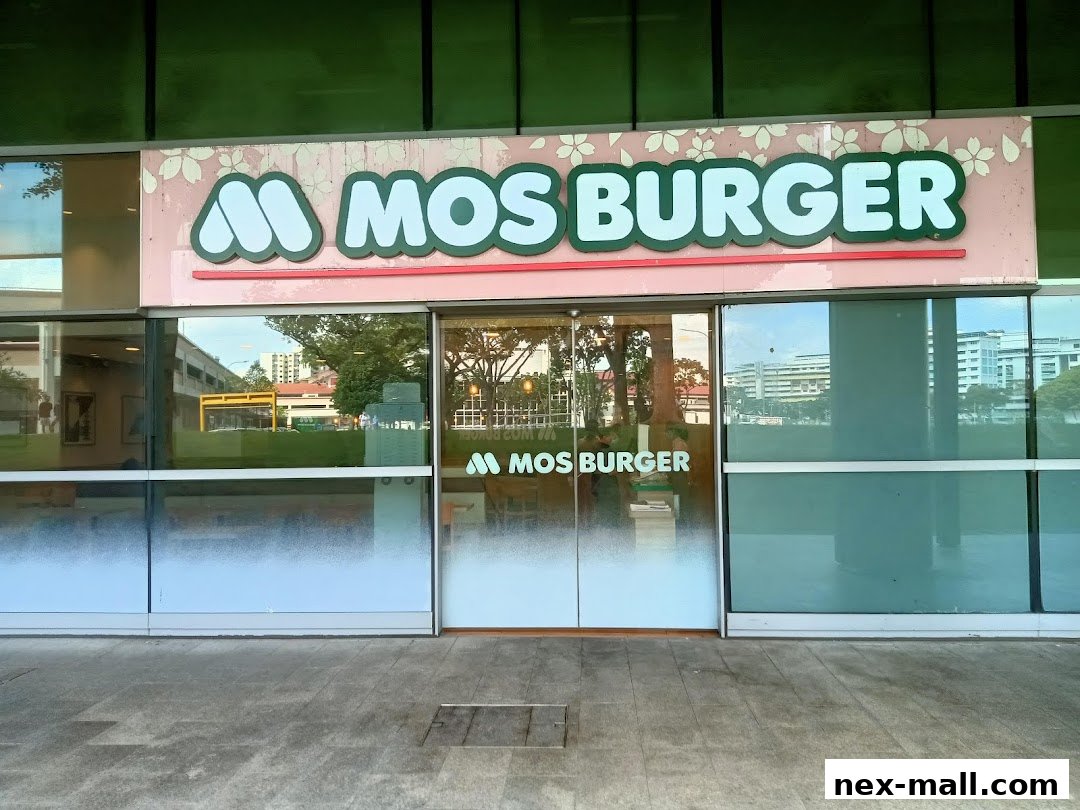 The exterior of a MOS Burger restaurant with its prominent signage and glass doors.