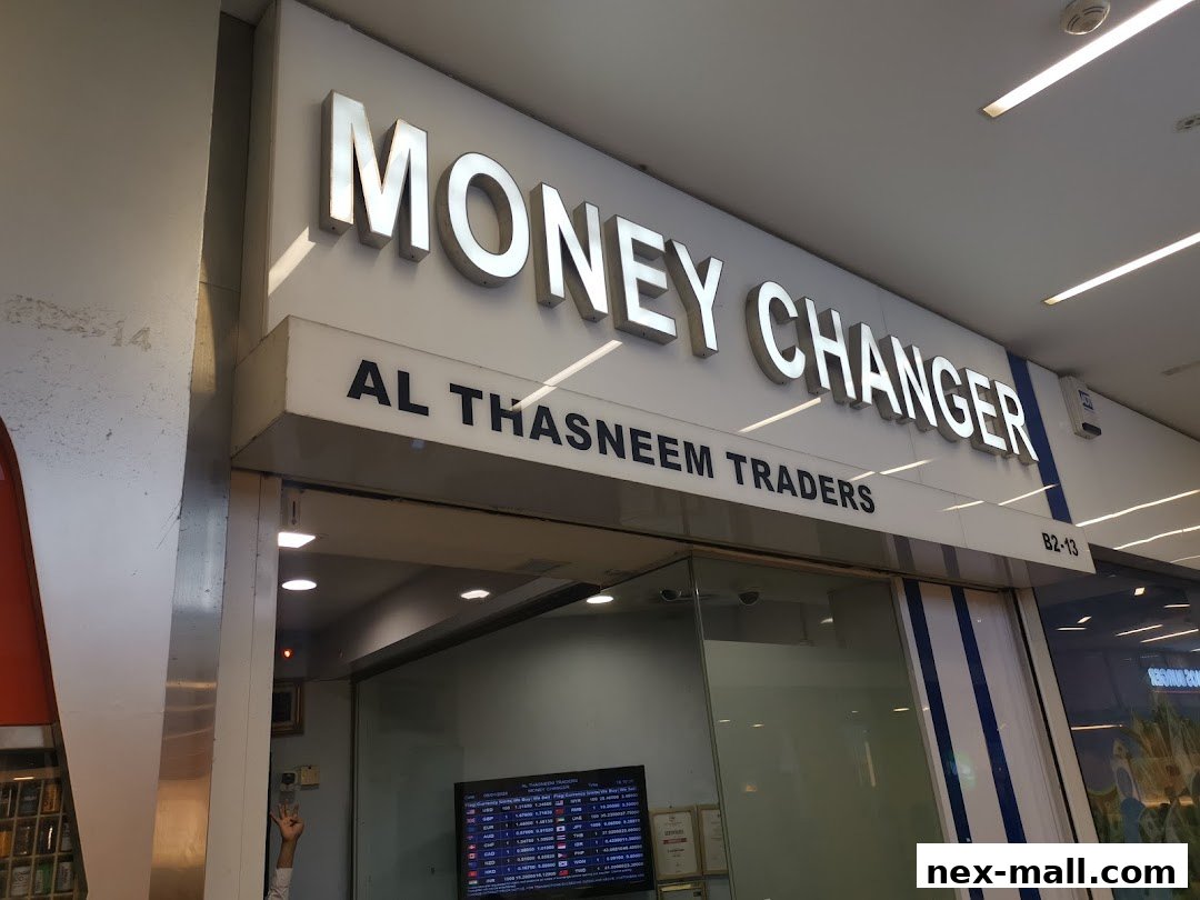 The exterior of AL Thasneem Traders Money Changer shop with prominent signage.