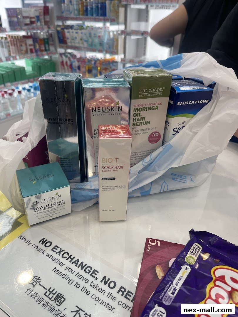 A collection of skincare and haircare products from various brands, including Neuskin and Bausch+Lomb, in a shopping bag.