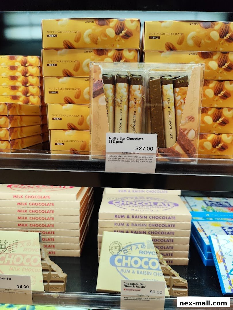 A display of Royce chocolates, including Nutty Bar Chocolate and Rum & Raisin Chocolate.