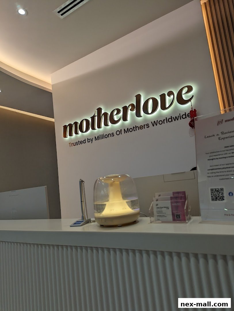 The Motherlove Nex shop interior features a well-lit reception desk with the brand's logo prominently displayed.
