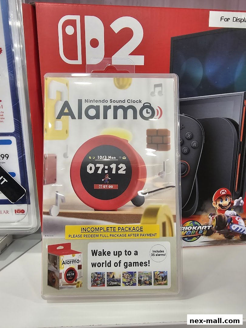 A Nintendo Sound Clock Alarmo with Mario Kart 8 Deluxe packaging in the background.