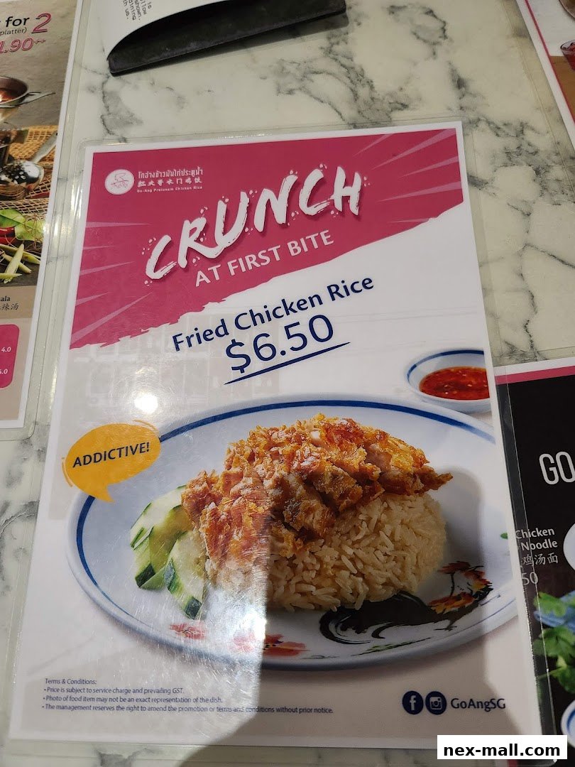 A menu featuring Fried Chicken Rice with a price of $6.50 and the slogan 'Crunch at First Bite'.
