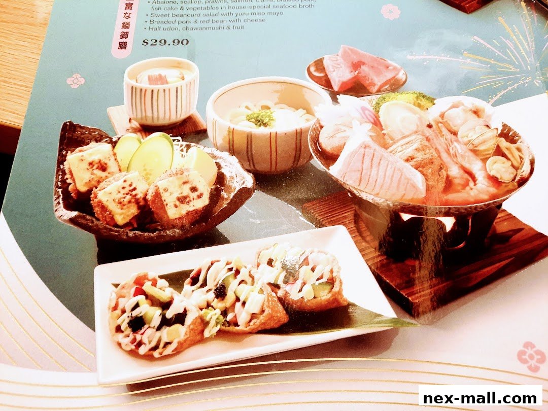 A menu featuring a Japanese hot pot dish with various seafood and side items.