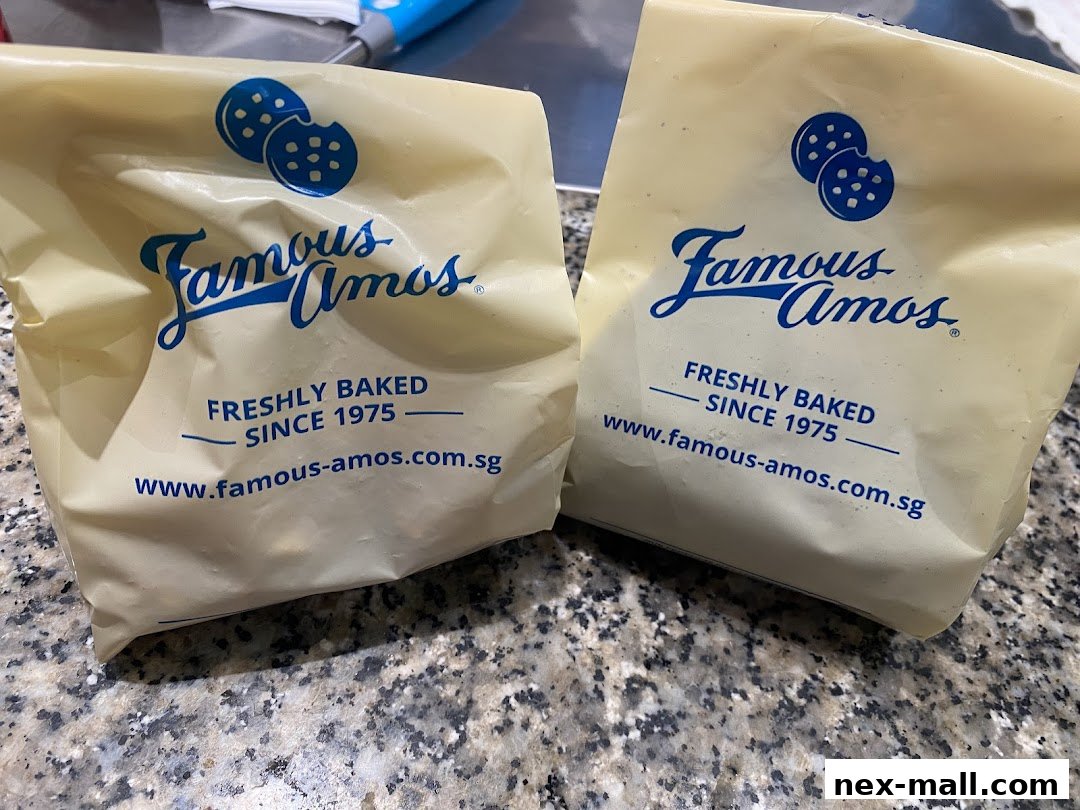 Two bags from Famous Amos, featuring their logo and 'Freshly Baked Since 1975'.