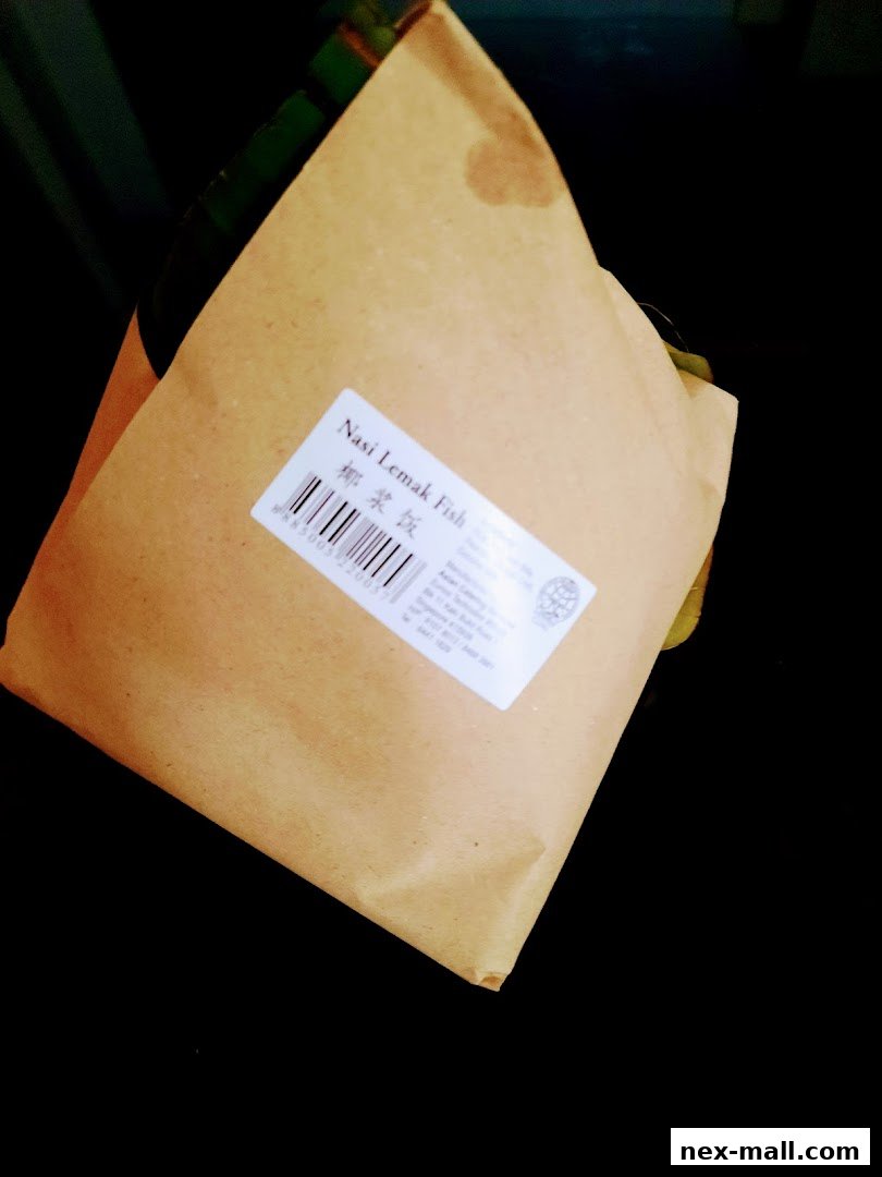A package of Nasi Lemak Fish from Bengawan Solo, wrapped in brown paper.