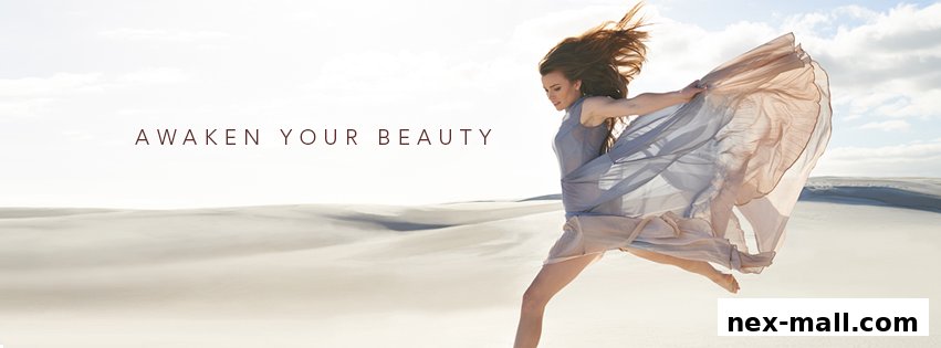 A woman in a flowing dress runs through a desert landscape with the text 'AWAKEN YOUR BEAUTY'.