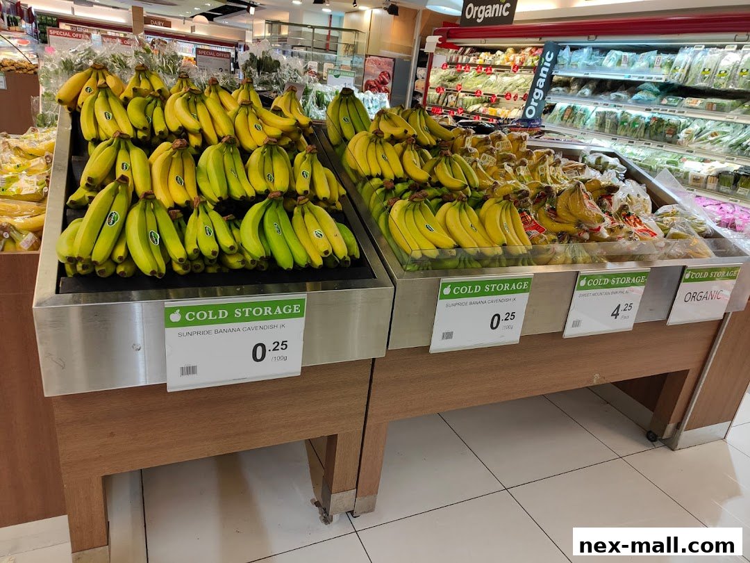 A display of fresh bananas and organic produce at Cold Storage supermarket.