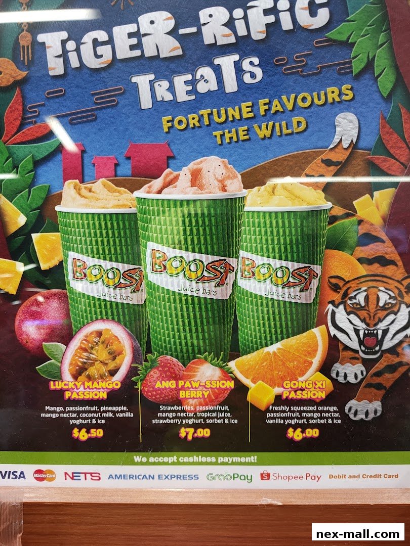 A menu board for Boost Juice featuring three smoothies with fruit ingredients and prices.
