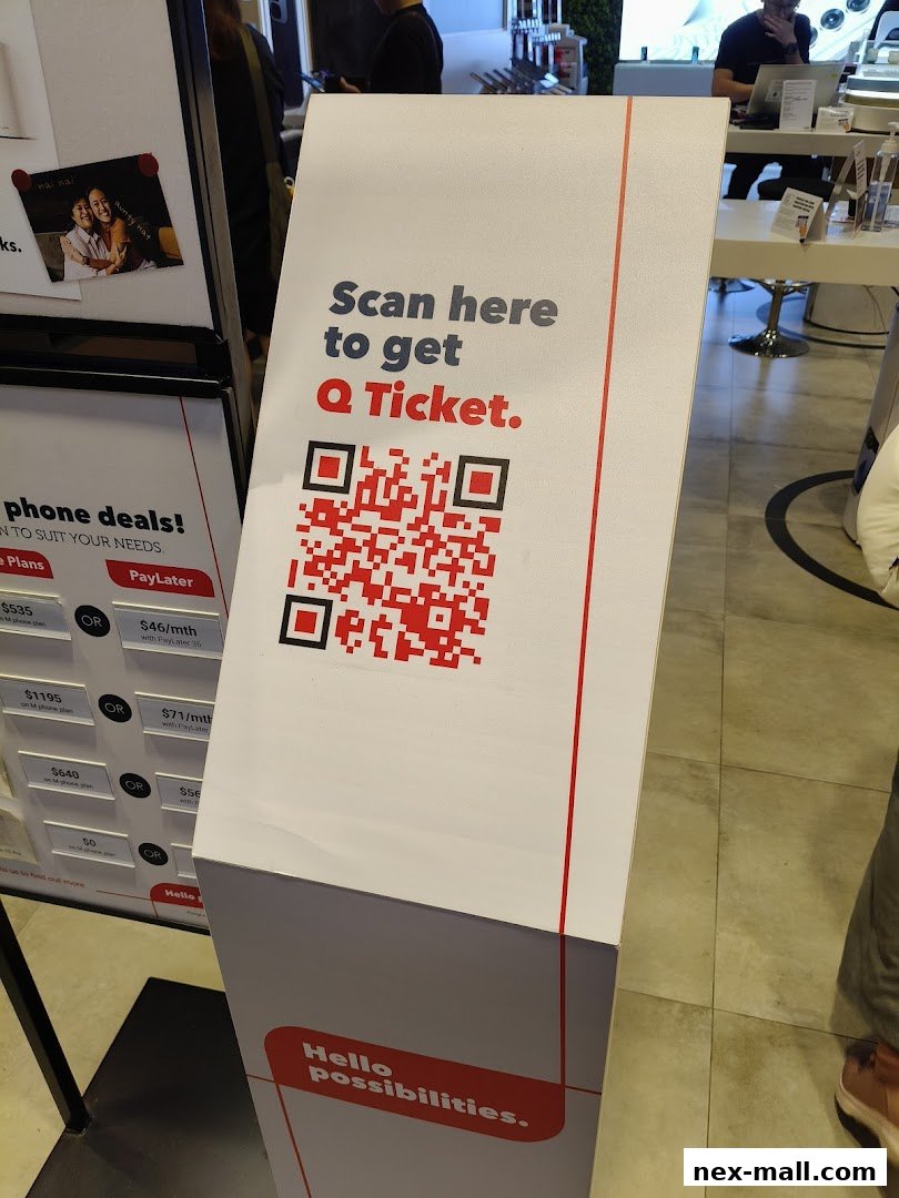 A sign with a QR code to get a Q Ticket and phone deals displayed.
