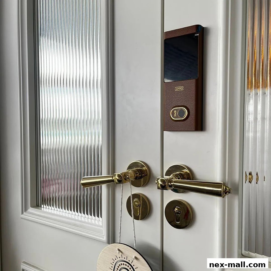 A close-up of a white door with brass handles and a digital lock.