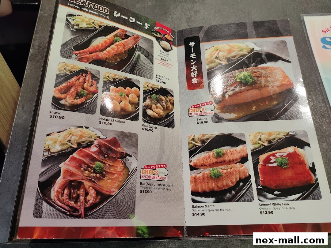 A menu featuring various seafood dishes, including prawns, scallops, oysters, squid, and salmon.