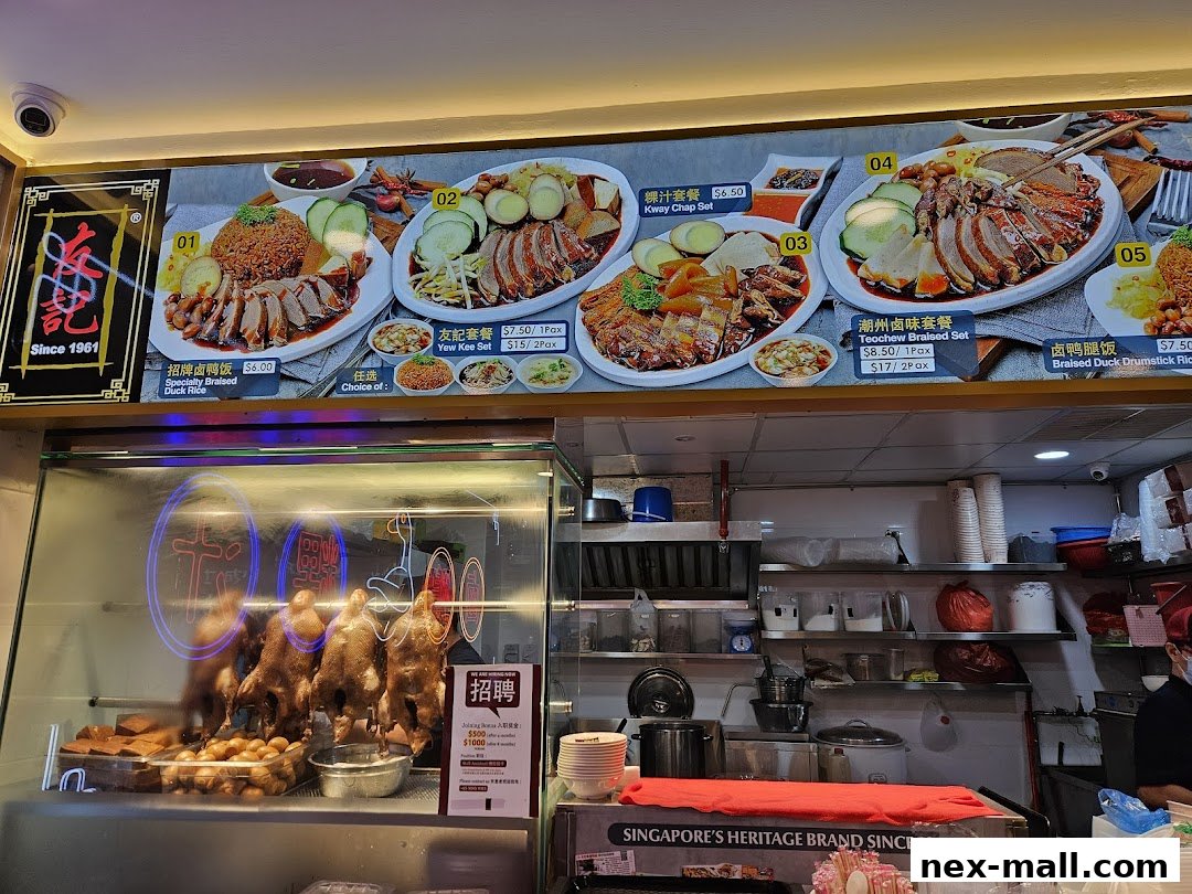 A menu board displaying various duck rice and kway chap sets with prices.