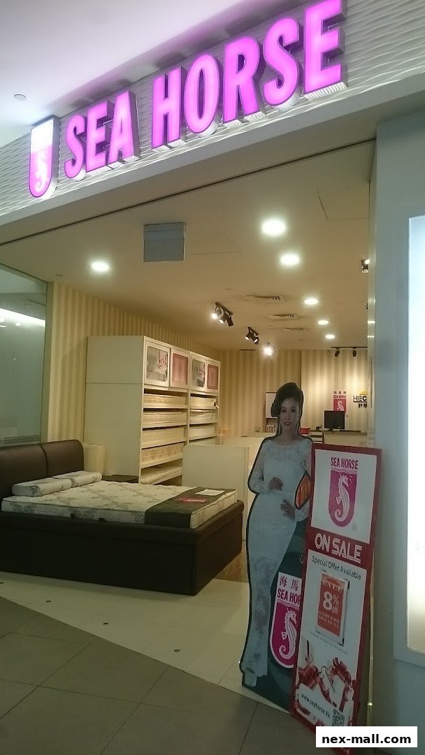 The Sea Horse shop front displays mattresses and a promotional stand with a sale offer.